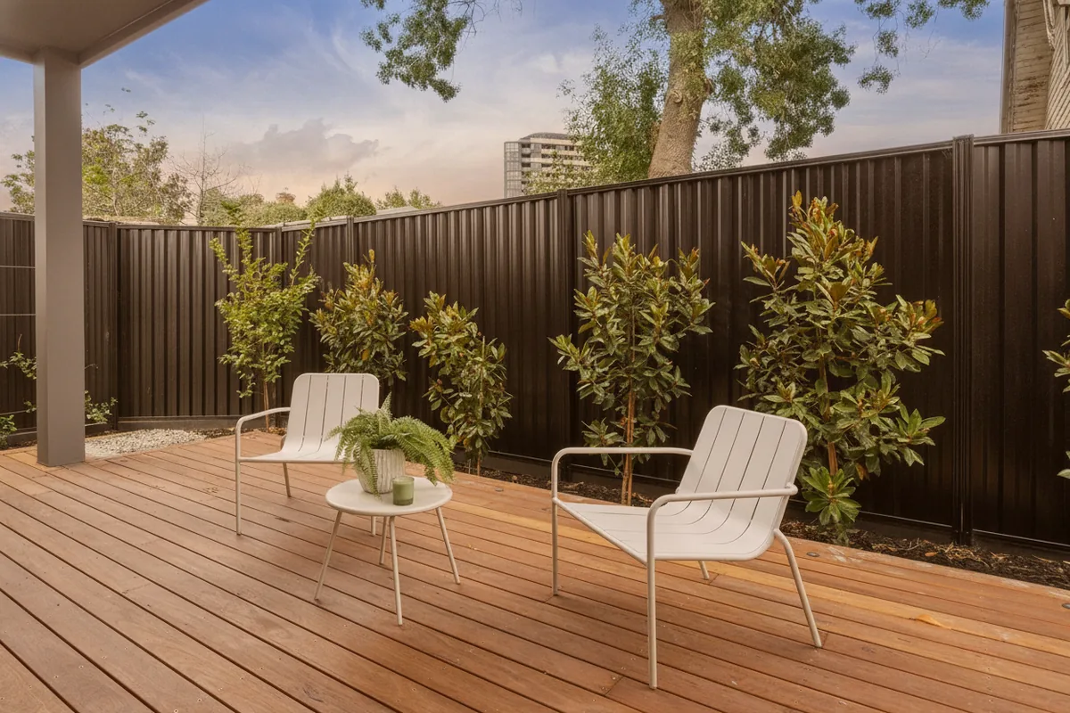 The same deck and courtyard turned to twilight