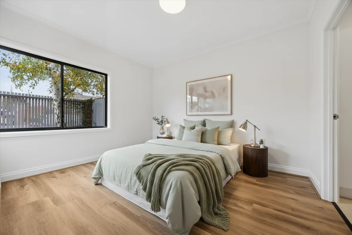 The same bedroom restyled with modern furnishings